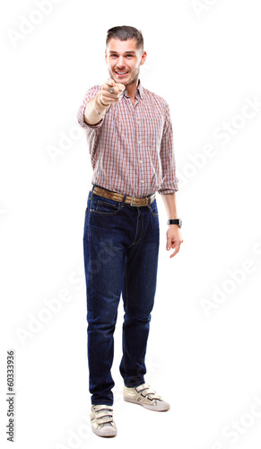 Photo: young business man pointing to the camera on white background young business man pointing to the camera on white background