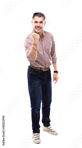 Photo: Excited handsome business man with arms raised in success Excited handsome business man with arms raised in success