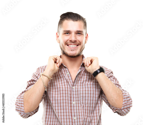 Photo: Handsome casual man smiling - isolated over a white background Handsome casual man smiling - isolated over a white background