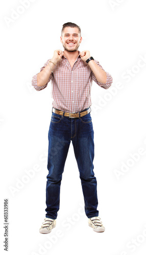 Photo: Handsome casual man smiling - isolated over a white background Handsome casual man smiling - isolated over a white background