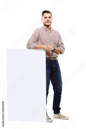 Photo: Happy business man presenting your text isolated on white Happy business man presenting your text isolated on white