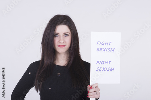 Photo: Fight Sexism young woman holding protest notice Fight Sexism young woman holding protest notice