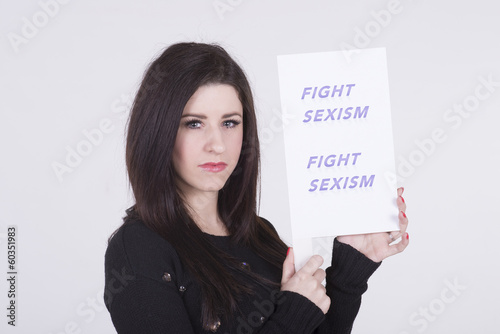 Photo: Fight Sexism young woman holding protest notice Fight Sexism young woman holding protest notice
