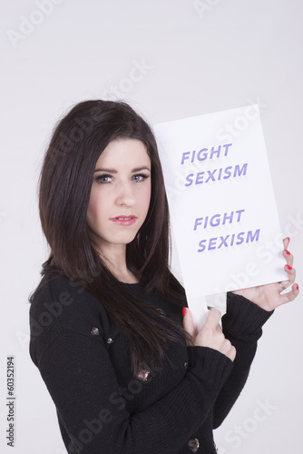 Photo: Fight Sexism young woman holding protest notice Fight Sexism young woman holding protest notice