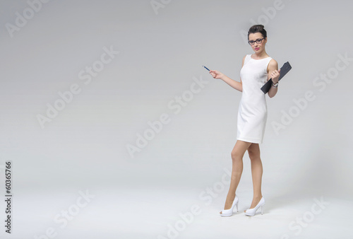 Photo: Attractive brunette lady in business uniform Attractive brunette lady in business uniform