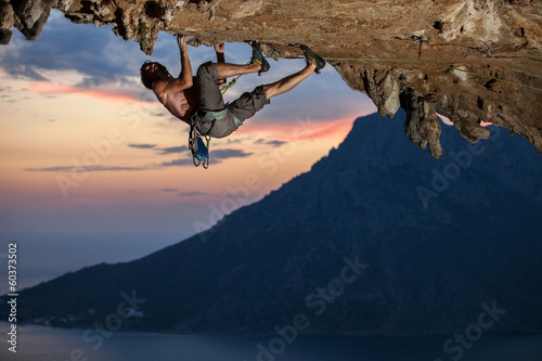 Fototapeta Rock climber at sunset, Kalymnos Island, Greece