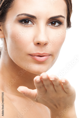 Photo: Beautiful woman, blowing kiss, on white Beautiful woman, blowing kiss, on white