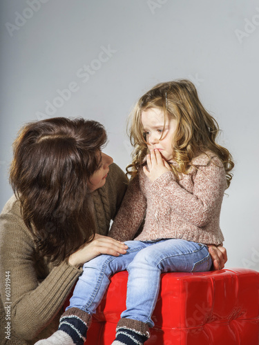 Photo: Mother reassuring little daughter Mother reassuring little daughter