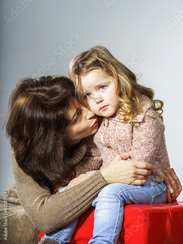 Photo: Mother reassuring little daughter Mother reassuring little daughter
