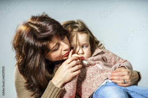 Photo: Mother reassuring little daughter Mother reassuring little daughter