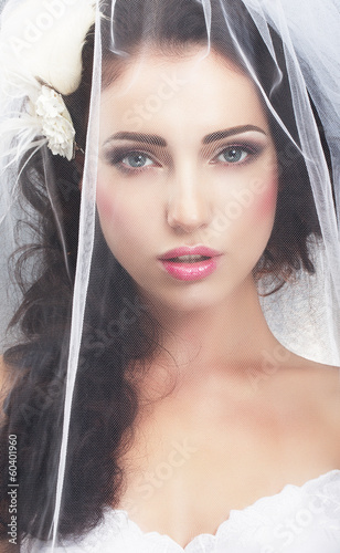 Photo: Delicacy. Caucasian Woman Hidden behind Traditional Bridal Veil Delicacy. Caucasian Woman Hidden behind Traditional Bridal Veil