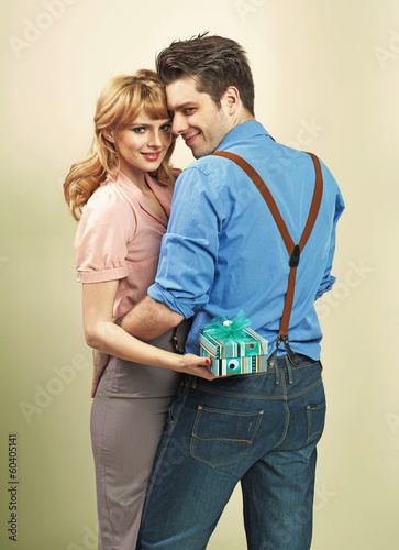 Photo: Attractive couple with gifts for valentine's day Attractive couple with gifts for valentine's day