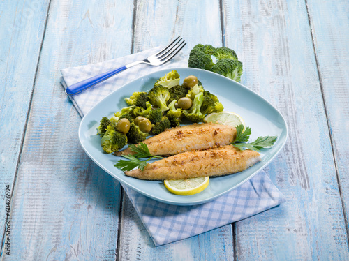 Photo: breaded fish with broccoli and olives breaded fish with broccoli and olives