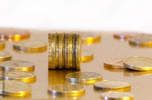 Photo: Coins are reflecting in the Golden surface Coins are reflecting in the Golden surface