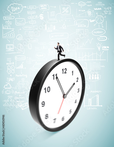 Photo: businessman runing on clock businessman runing on clock