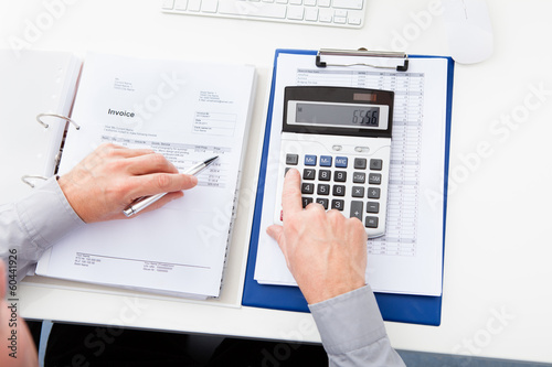 Photo: Businessman Calculating Finance Businessman Calculating Finance