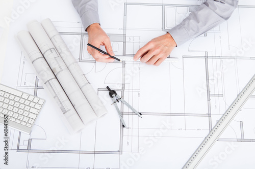 Photo: Architect Drawing On Blueprint Architect Drawing On Blueprint