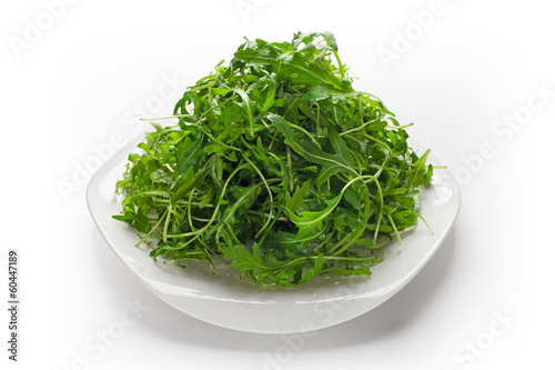 Photo: Green ruccola salad isolated Green ruccola salad isolated