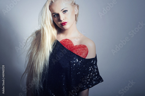 Photo: Beautiful Blond Woman with Red Heart.Symbol Under Black Dress Beautiful Blond Woman with Red Heart.Symbol Under Black Dress