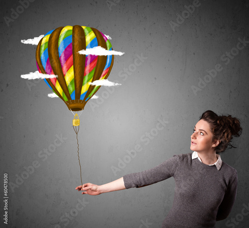 Photo: Woman holding a balloon drawing Woman holding a balloon drawing