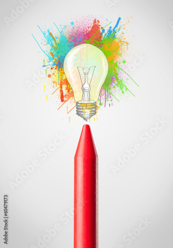Photo: Crayon close-up with colored paint splashes and lightbulb Crayon close-up with colored paint splashes and lightbulb