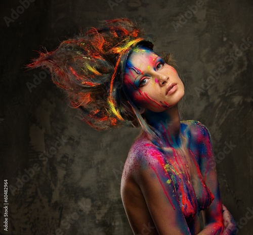 Photo: Young woman muse with creative body art and hairdo Young woman muse with creative body art and hairdo