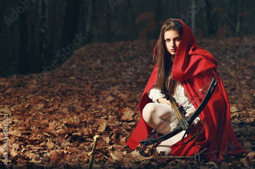 Photo: Little red riding hood in the dark forest Little red riding hood in the dark forest