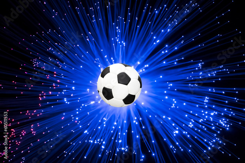 Illustration: Football launched a ray of blue light background Football launched a ray of blue light background
