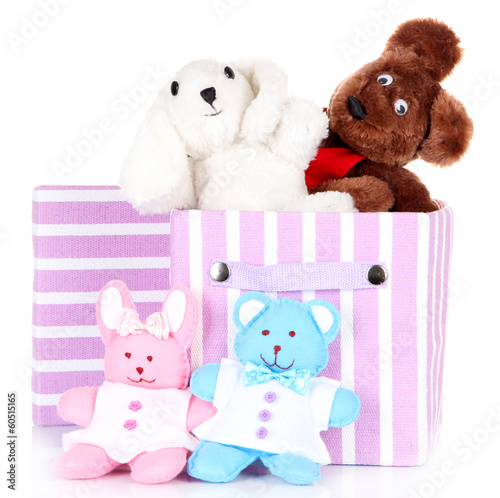 Photo: Textile box with toys, isolated on white Textile box with toys, isolated on white