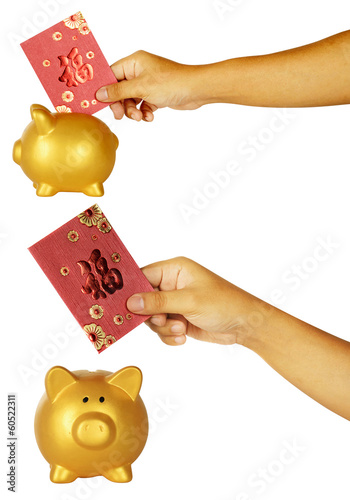 Photo: Insert Red Envelope Into Piggy Bank Insert Red Envelope Into Piggy Bank