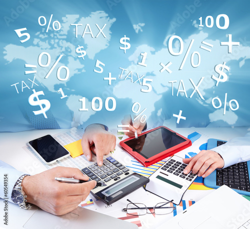 Photo: Hands of business people with calculator. Hands of business people with calculator.