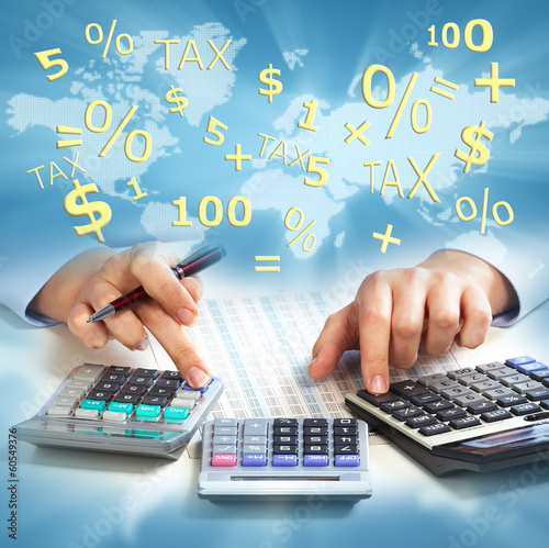 Photo: Hands of business people with calculator. Hands of business people with calculator.