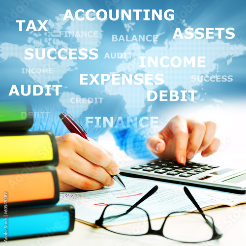 Photo: Hands of business people with calculator. Hands of business people with calculator.