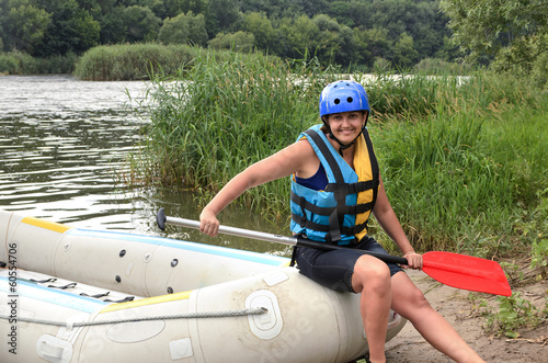 Photo: Woman going white water rafting Woman going white water rafting