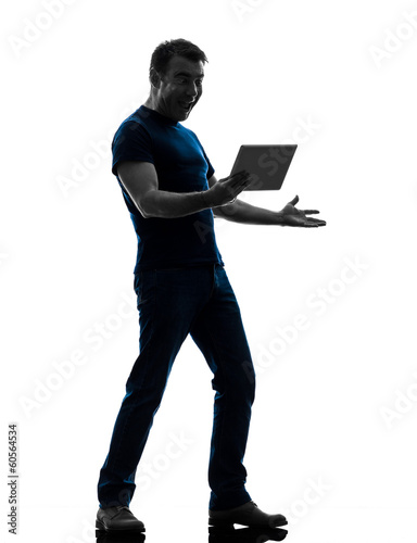 Photo: man holding watching digital tablet silhouette man holding watching digital tablet silhouette