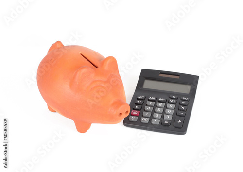 Photo: Piggy bank and calculator Piggy bank and calculator