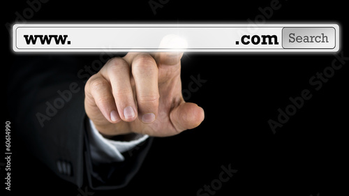 Photo: Man accessing a domain name on a virtual screen Man accessing a domain name on a virtual screen