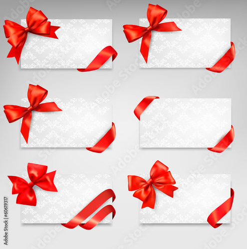 Vector: Collection of gift cards with red ribbons. Vector background Collection of gift cards with red ribbons. Vector background
