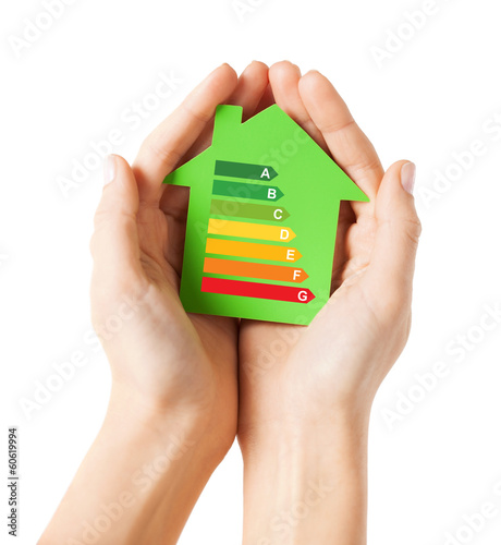 Photo: hands holding green paper house hands holding green paper house