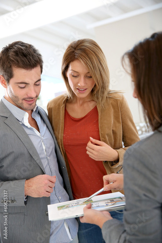 Photo: Couple meeting architect for house construction Couple meeting architect for house construction