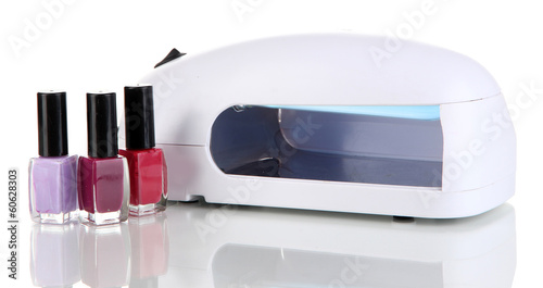 Photo: Lamp for nails and nail polishes isolated on white Lamp for nails and nail polishes isolated on white