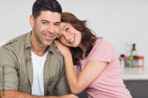 Photo: Portrait of a smiling couple in kitchen Portrait of a smiling couple in kitchen
