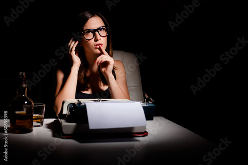 Photo: Novelist thinking of the story she's going to write Novelist thinking of the story she's going to write