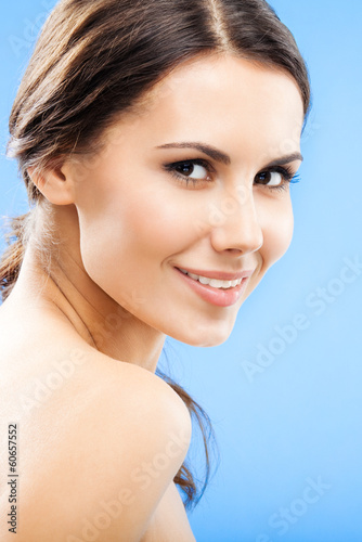 Photo: Portrait of beautiful woman, on blue Portrait of beautiful woman, on blue