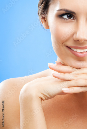 Photo: Portrait of beautiful woman, on blue Portrait of beautiful woman, on blue