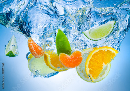  Tropical fruits fall deeply under water with a big splash