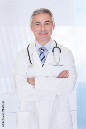 Photo: Portrait Of Happy Mature Male Doctor Portrait Of Happy Mature Male Doctor