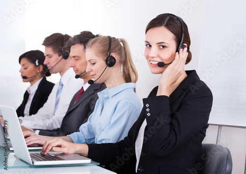 Photo: Happy Female Telephone Worker Happy Female Telephone Worker