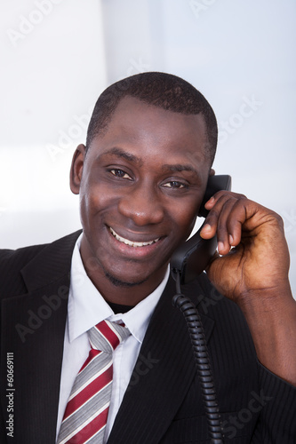 Photo: African Businessman Working At Office African Businessman Working At Office