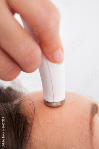 Photo: Woman Under Going Microdermabrasion Treatment Woman Under Going Microdermabrasion Treatment